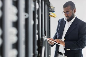 Handsome African American man with tablet computer